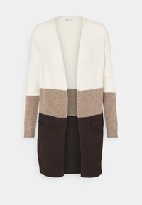 Polvipituinen neuletakki kolmivärisellä designilla: kerma, vaaleanruskea ja tummanruskea. Etuosassa avoin malli ja kaksi etutaskua. Pehmeä rakenne.