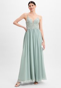 Mintgrünes Abendkleid mit einem enganliegenden, bestickten Oberteil und einem fließenden, plissierten Rock. Es verfügt über Spaghettiträger und einen tiefen V-Ausschnitt.