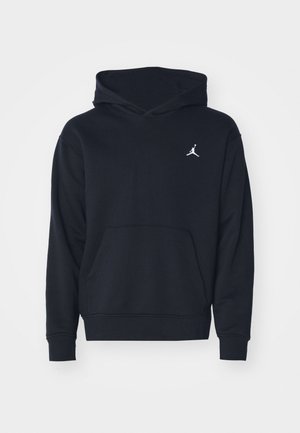 Schwarzer Kapuzenpullover aus Baumwollmischung, ausgestattet mit einer vorderen Kängurutasche und einem weißen Air Jordan-Logo auf der Brust.