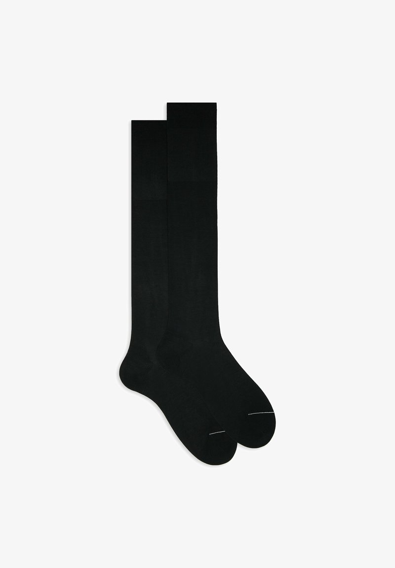 Black knee-high socks made of smooth material. Features a reinforced toe and minimal stitching. Classic design with a seamless finish.
