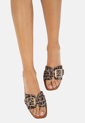 Leopard print slide sandals in dark gray and brown, featuring gold-tone buckle hardware and open-toe design with a flat sole.