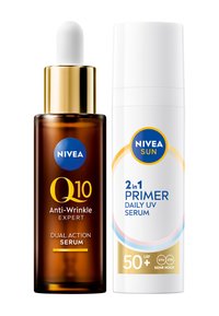 Brown glass dropper bottle with a golden cap labeled "Q10 Anti-Wrinkle Expert." Next to it, a white bottle with blue accents labeled "2-in-1 Primer Daily UV Serum."