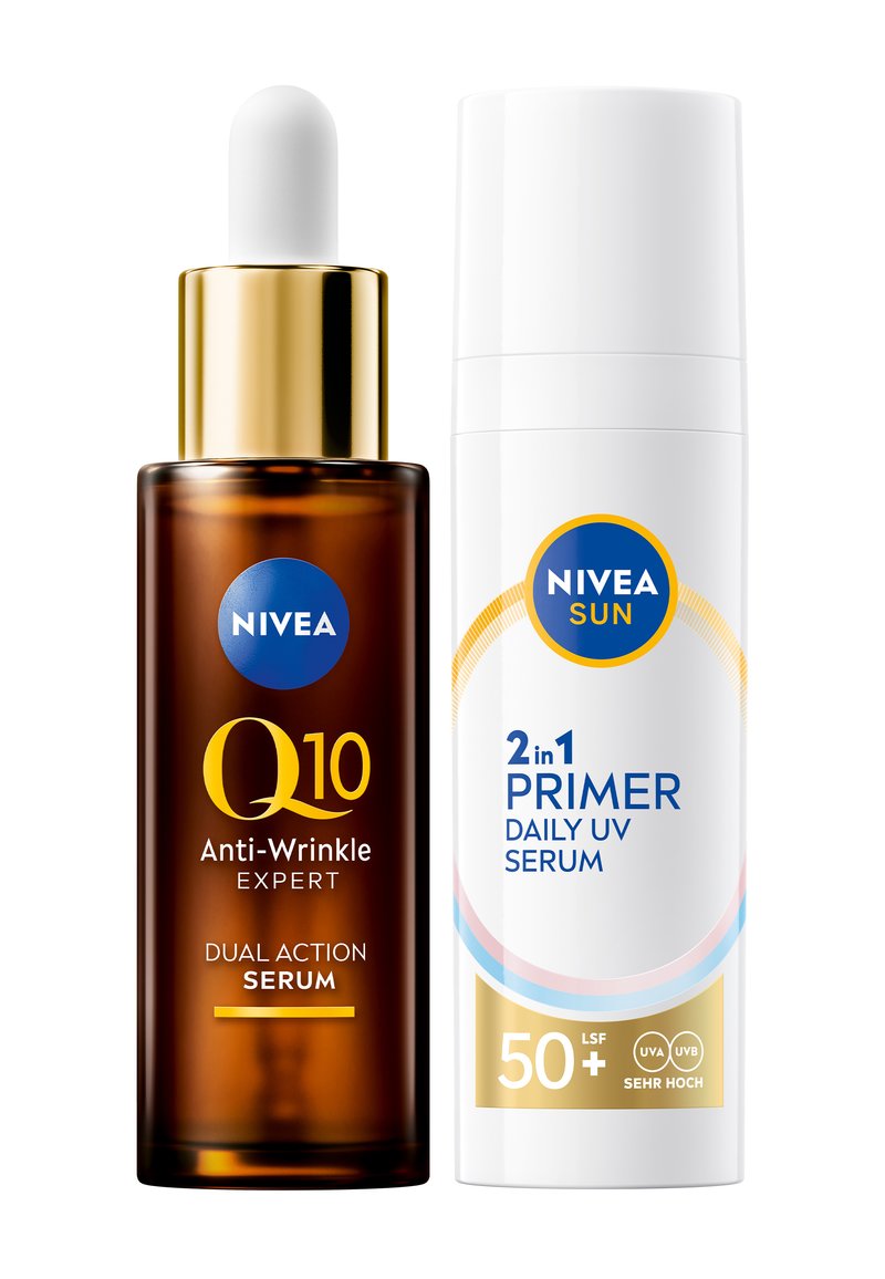 Brown glass dropper bottle with a golden cap labeled "Q10 Anti-Wrinkle Expert." Next to it, a white bottle with blue accents labeled "2-in-1 Primer Daily UV Serum."
