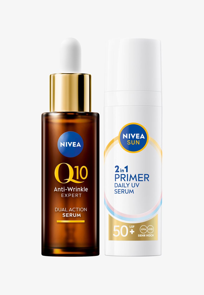 Brown glass dropper bottle with a golden cap labeled "Q10 Anti-Wrinkle Expert." Next to it, a white bottle with blue accents labeled "2-in-1 Primer Daily UV Serum."