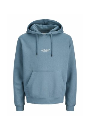 Hooded sweatshirt in light blue, made of soft fabric, featuring a front pocket and drawstrings. Contains white logo text on the chest.