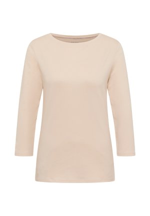Jasnobeżowa, długorękawowa koszulka z miękkiej bawełny. Posiada okrągły dekolt i luźny fason. Gładka tekstura z minimalną ilością szwów.