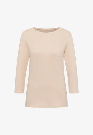 Jasnobeżowa, długorękawowa koszulka z miękkiej bawełny. Posiada okrągły dekolt i luźny fason. Gładka tekstura z minimalną ilością szwów.