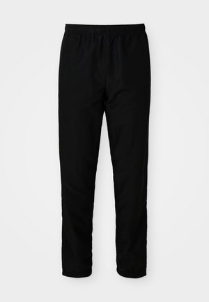 Pantalons noirs à taille élastique avec une coupe droite, fabriqués en tissu lisse, dotés de poignets élastiques aux chevilles et sans poches visibles.