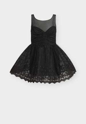 Schwarzes ärmelloses Kleid mit durchsichtigem Ausschnitt, gerafftem Oberteil, ausgestelltem Spitzenrock und wellenförmigem Saumdetail.