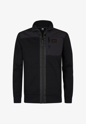 Chaqueta negra de cremallera con panel en contraste negro en los hombros y bolsillo en el pecho. Cuenta con puños y dobladillo de canalé, fabricada con material suave.