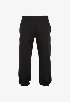 Pantaloni della tuta neri realizzati in tessuto morbido, con un elastico in vita e polsini elastici alla caviglia, offrono una vestibilità rilassata e comfort.