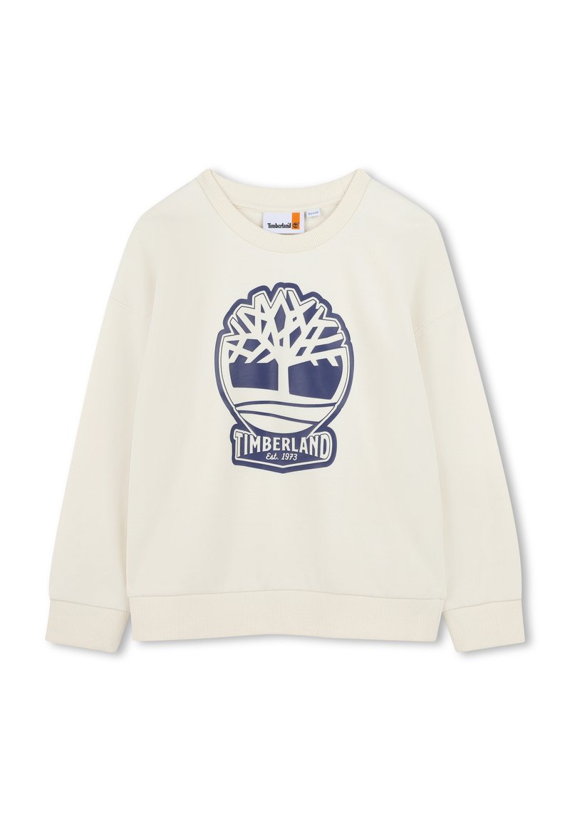 Felpa color crema con scollo rotondo e maniche lunghe. Presenta un logo grafico blu di un albero e il testo "Timberland" al centro.