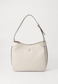 Sac à main en cuir beige avec une sangle d'épaule unique, forme arrondie, design minimaliste et un petit logo triangulaire à l'avant.