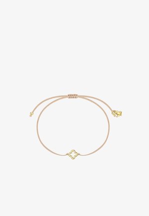 Justerbar beige snorarmbånd med en lille guldfarvet firkløver ved midten og guldfarvede perler ved enderne.