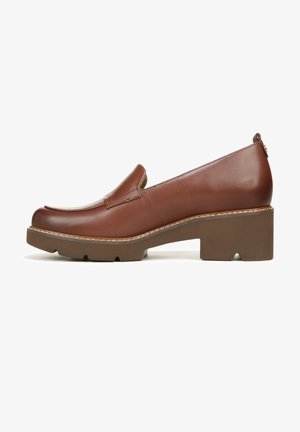 Brown leather slip-on shoe with a rounded toe, elevated block heel, and textured sole. Features subtle stitching and sleek design.
