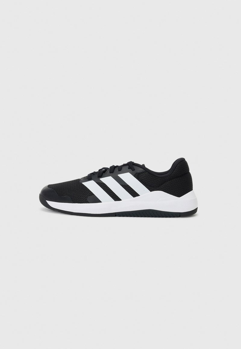 Black athletic shoe with mesh upper, three white stripes on the side, padded collar, and textured rubber sole. Lightweight design.