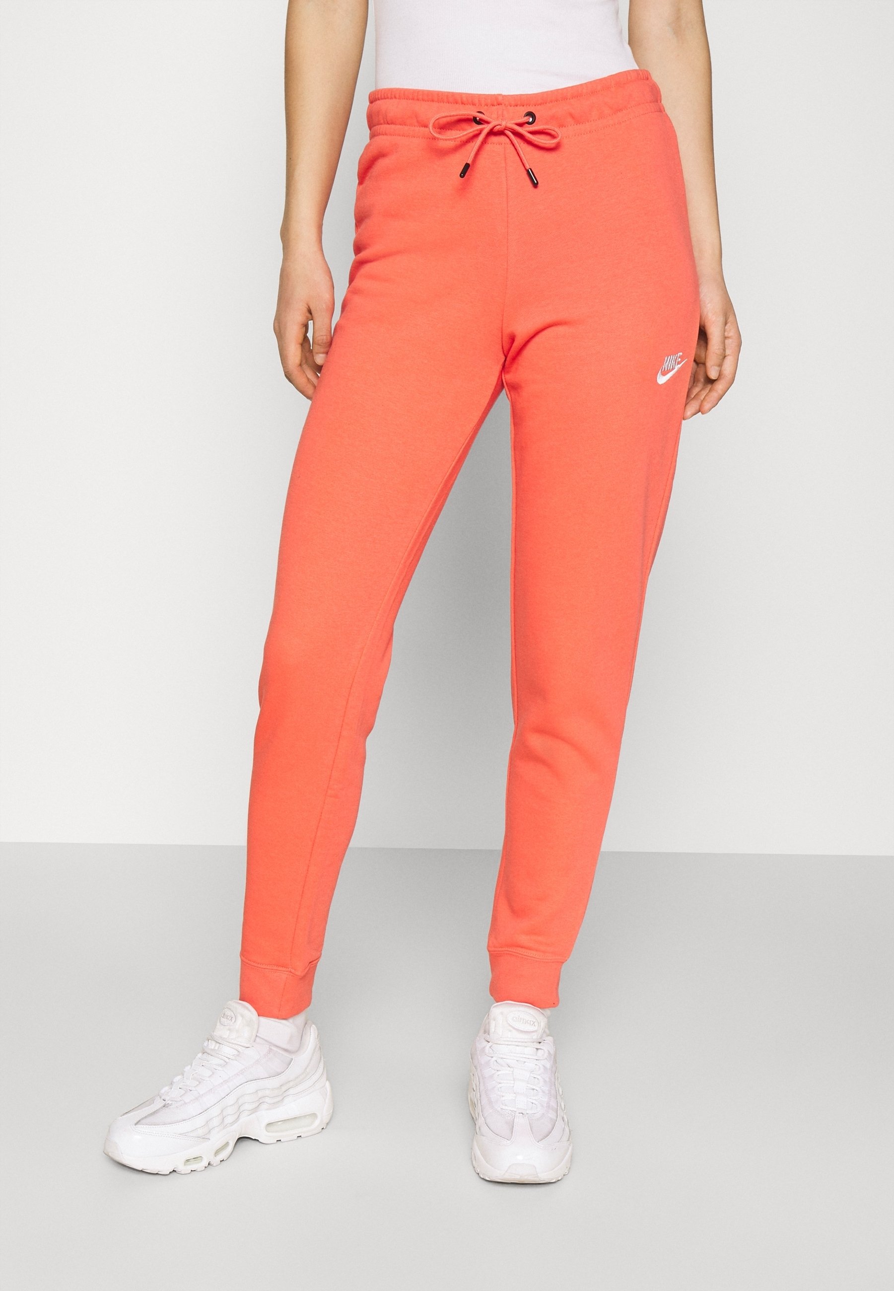 orange nike joggers womens