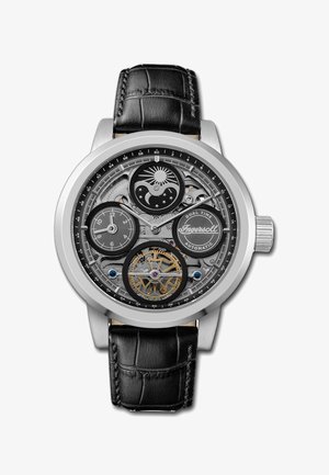 Zilveren roestvrijstalen horloge met een zwart krokodillenpatroon leren band. Transparante wijzerplaat onthult ingewikkelde mechanismen en dubbele tijdslokaal functies.