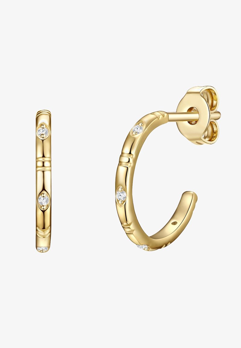 Zelta auskari ar bambusa dizainu, kas rotāti ar trim mazām, apaļām caurspīdīgām dārgakmeņiem. Gluda tekstūra ar pulētu apdari.