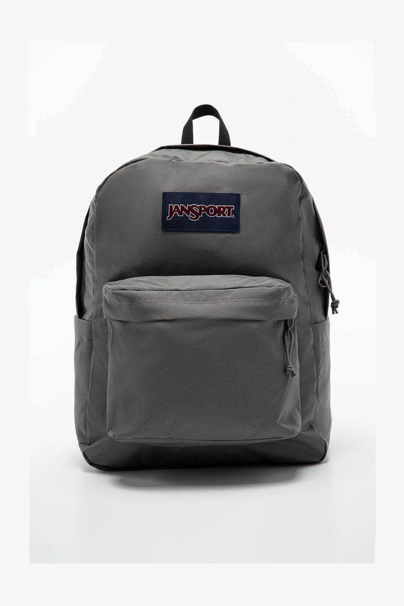 Sac à dos Jansport gris avec une poche avant, des bretelles réglables et une poignée de transport en haut. Fabriqué en tissu durable avec une texture lisse.