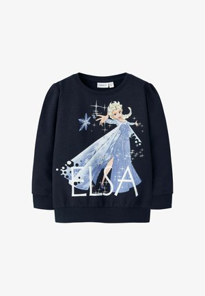 Dunkelblauer Sweater mit Elsa aus "Die Eiskönigin", die in einem glitzernden blauen Kleid Eiszauber wirkt, mit dem Text "ELSA" darunter.