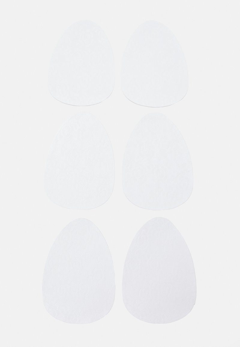 Dischetti adesivi bianchi a forma di uovo, con una superficie testurizzata. Sei dischetti disposti in due file, di dimensioni e forme uniformi.