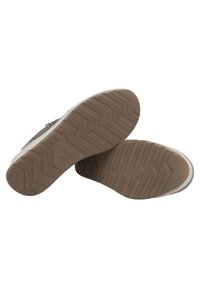 Braune Gummisohle-Schuhe mit einem Zickzackmuster, featuring eine glatte Oberseite und einen weißen Akzent. Enthält einenmetallischen Reißverschluss an der Seite.