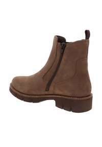 Stivale alla caviglia in suede marrone con cerniera laterale, linguetta per il sollevamento e suola spessa con battistrada, mostrato dal lato esterno.