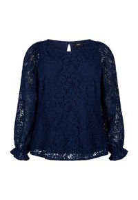 Navyblaue Spitzenbluse mit langen, puffigen Ärmeln und einem Schlüsselrücken. Sie verfügt über ein strukturiertes Blumenmuster und Rüschenmanschetten.