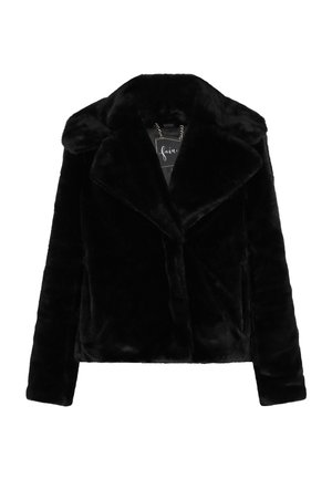 Chaqueta de pelaje sintético negro con solapas en pico, diseño de doble botonadura y detalle de cadena ajustable en la etiqueta del cuello. Textura suave.