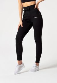 Carpatree BELLE - Verryttelyhousut - black