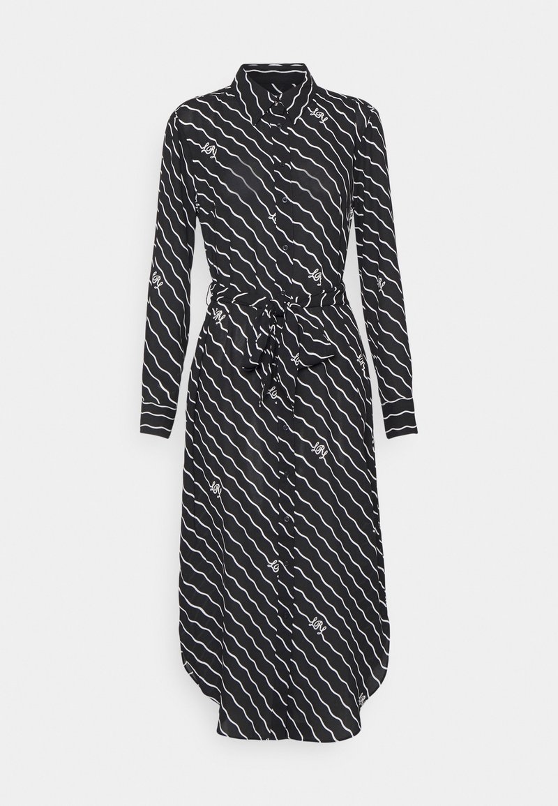 Black shirt dress with long sleeves and button-down front. Features a wave pattern in white and a tied waist detail. Smooth fabric texture.