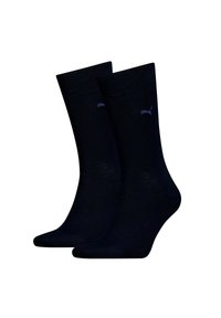 Calcetines de algodón de color azul marino, de corte crew, con una textura suave. Presentan un pequeño logo bordado en el lateral y puños acanalados en los tobillos.