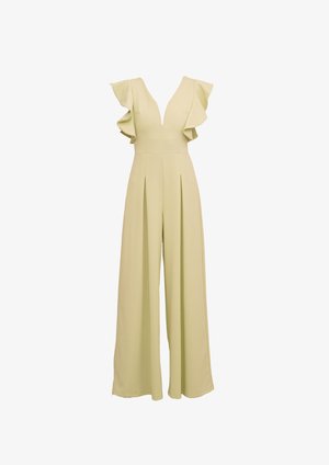 Helebeež värviga laiad jalgadega ülikond, millel on sügav V-kaelus ja volangidega õlavarre sääred, rõhutades vöökohtades voldikuid ja voolavat kangast.