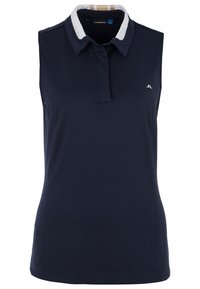 Hihaton laivastonsininen poolopaita, jossa valkoiset kauluskohdat ja hillitty logo. Sileä tekstuuri, räätälöity istuvuus ja klassiset design-elementit.