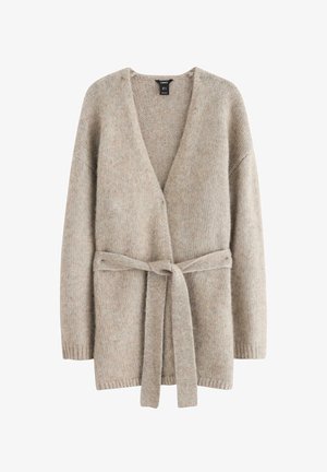 Beige strikket cardigan med v-hals, åbent front, lange ærmer og bindebånd ved taljen. Blød tekstur og løs pasform.