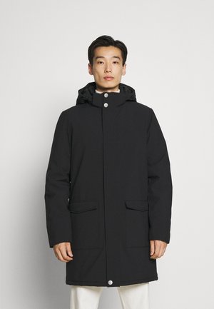 Black waterproof parka featuring a hood, snap closures, and two front pockets. Smooth texture and straight cut for warmth and coverage.