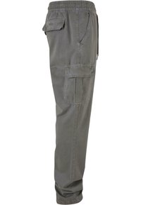 Lichtgrijze cargobroek met een elastische tailleband, zijzakken en een zachte, gladde textuur, met een relaxte pasvorm en een taps toelopend ontwerp.