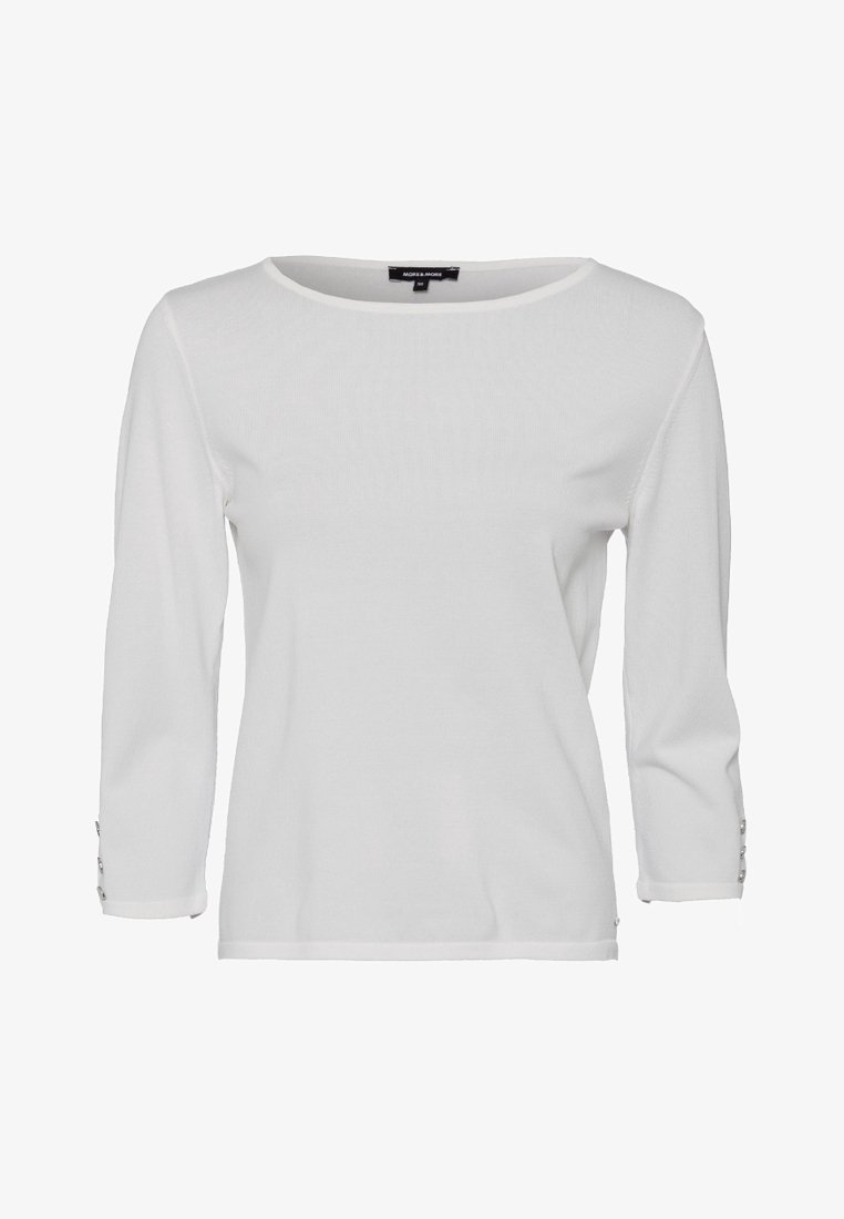Chemise blanche à manches longues avec encolure ronde et détails de boutons sur les poignets, présentée sur un fond blanc uni.