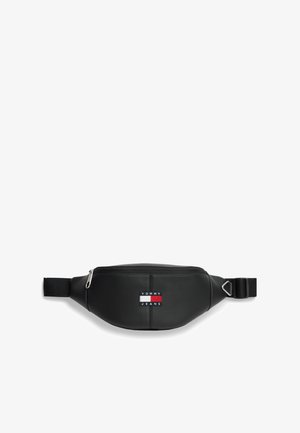 Mustast nahast vöökott lukuga, millel on punase, valge ja sinise värviga ristpistes ristkülikukujuline logo ning reguleeritav rihm.