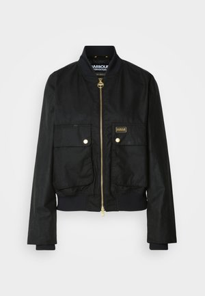 Black bomber jacket with two front pockets and a gold zipper. Features a ribbed collar and cuffs, made from a smooth, lightweight material.