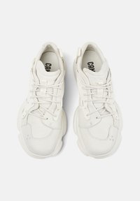 White sneakers made of leather and mesh, with a textured finish, rounded toe, and laces. Features subtle branding on the insole.