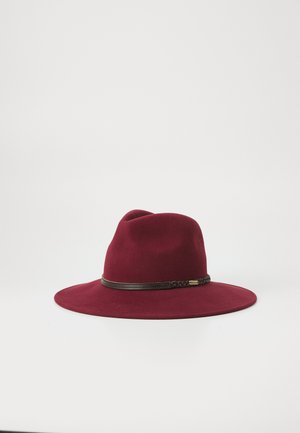 Wide-brimmed burgundy felt hat with a dark brown braided leather band and a small metallic brand tag on a white background.
