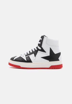 High-top sneaker featuring a white leather upper with black star and zigzag accents, red rubber outsole, and white laces.