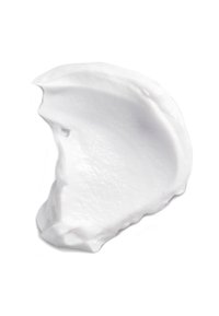 Una crema idratante bianca, spessa e cremosa, spalmata su una superficie, con una consistenza liscia, leggere ondulazioni e una finitura lucida.