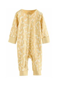 Gul babyjumpers med långa ärmar, som har ett vitt abstrakt mönster, dragkedja och ribbade ärmslut för en snug passform. Mjuk tygtextur.