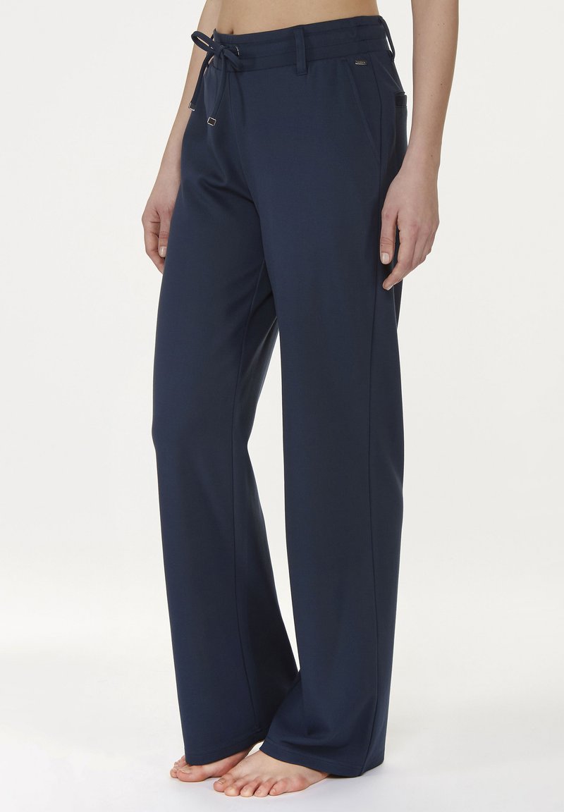 Navy blue wide-leg pants made of lightweight fabric, featuring a drawstring waist, side pockets, and a smooth texture.