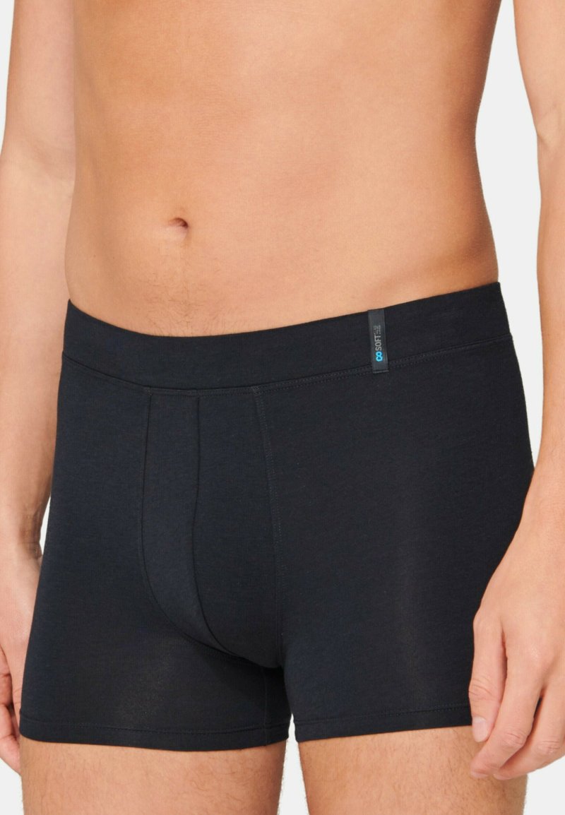 Black boxer briefs made of soft, stretchy material. Features a snug waistband and a central seam for support. Smooth texture overall.
