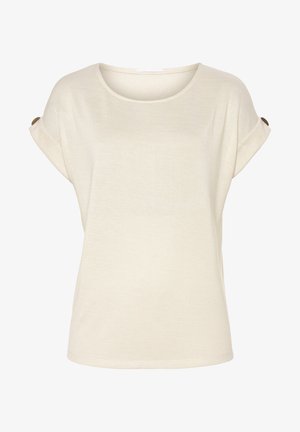 Haut beige à manches courtes avec un col rond, texture douce, manches retroussées et boutons de détail sur les manches. Design simple et ample.