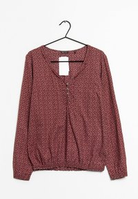 Blouse bordeaux à manches longues avec un décolleté en U, patte de boutonnage et taille élastique ; présente un petit motif floral sur l'ensemble.